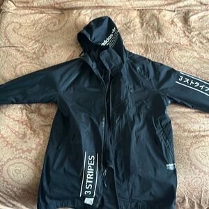 This is a one of a kind adidas trench coat. Very good condition.